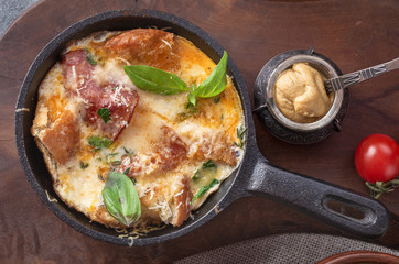 Frittata with sausage bread and cheese close-up, top view