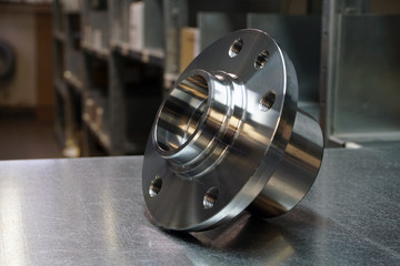 Details of a front or rear susnension of a modern car. New wheel hub assembly with bearing. New original quality spare parts . Trade in original quality spare parts. Service and repair of a modern car