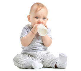 Baby with bottle of milk on white background