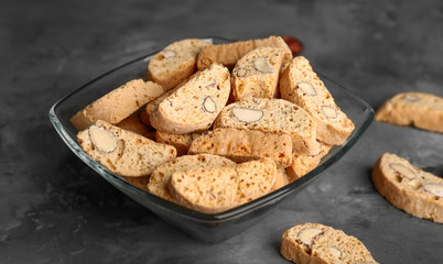 Bowl with sweet almond cookies on table