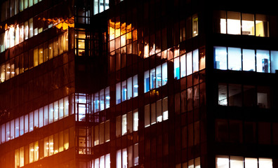 Office building exterior in the late evening with interior lights on