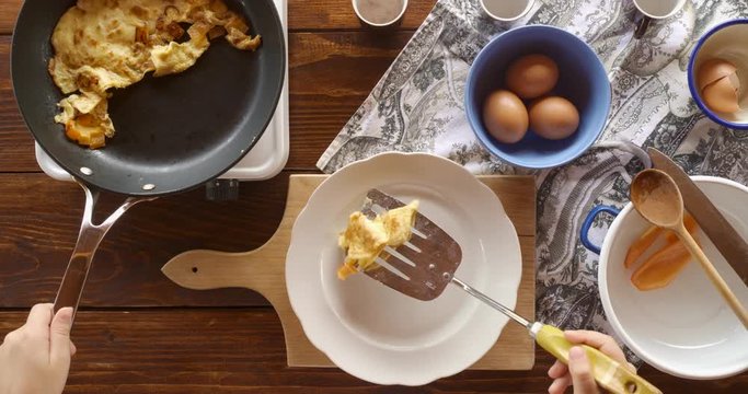 Top view food. Cooking With Mother. Beautiful Little Girl Learns How To Make Fried Egg.
