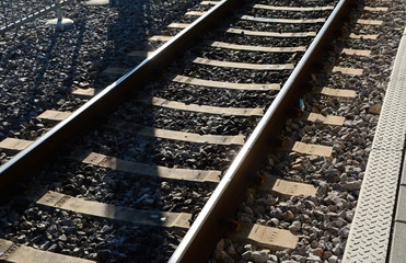 Fototapeta premium Autumn view of the outgoing railway. Railway or railroad tracks for train transportation.