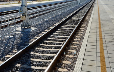 Fototapeta premium Autumn view of the outgoing railway. Railway or railroad tracks for train transportation.