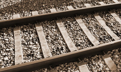 Naklejka premium Autumn view of the outgoing railway. Railway or railroad tracks for train transportation.