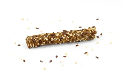 Sesame- linen stick crackers. Pretzel bread stick with sesame and linen, flax seeds isolated on white background.