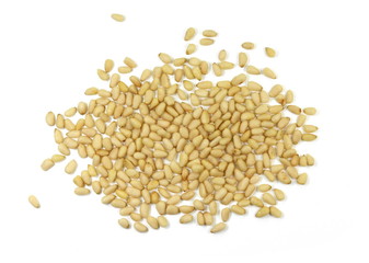 peeled pine nuts isolated on a white background 