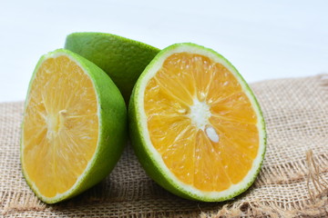 Fototapeta na wymiar fresh oranges whole and sliced