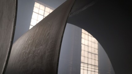 Large diameter metal pipe in the production room. Production of large metal pipes.