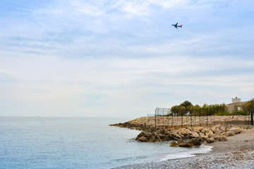 Fototapeta na wymiar Panorama of the French Riviera with flying plane near the city of Nice, France. Travel concept