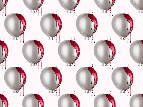 Grey balloons in red paint dripping. Creative pattern.