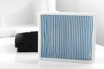 New white square dust filter for vacuum cleaner.