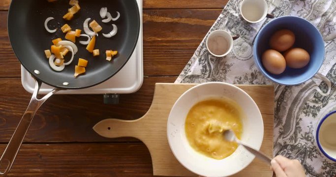 Top view food. Cooking With Mother. Beautiful Little Girl Learns How To Make Fried Egg.