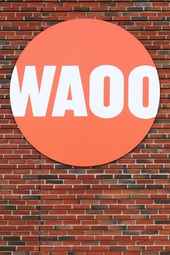 Tilst, Denmark - October 7, 2018: Waoo logo on a wall. Waoo is a Danish provider of internet, TV and telephony via the fiber network