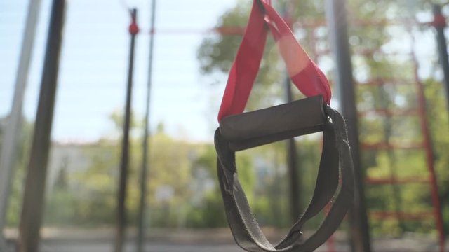 Close up of pair with black hinges tape hanging outdoors