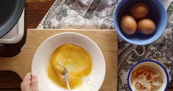 Top view food. Cooking With Mother. Beautiful Little Girl Learns How To Make Fried Egg.