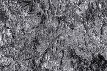 Grey spots and smears of oil painting on wall, texture in monochrome colors close-up, dark shades, grunge design, for background