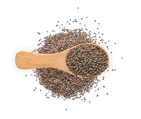 Perilla herb seed in wood spoon isolated on white background. top view