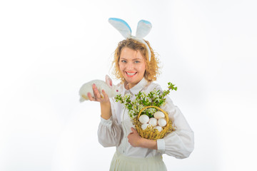 Easter. Girl holds basket with eggs and Easter bunny. Religion symbol. Basket with eggs. Eggs hunt. Easter egg. Bunny. Rabbit ears. Spring holiday. Happy Easter day.