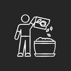 Planting flower seeds chalk white icon on black background. Propagating houseplants. Plant growing process. Domestic plants cultivation. Putting seeds in soil. Isolated vector chalkboard illustration