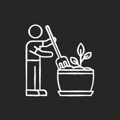 Soil fluffing chalk white icon on black background. Plowing, ploughing earth. Houseplant care. Aeration. Plant growing, planting process. Indoor gardening. Isolated vector chalkboard illustration