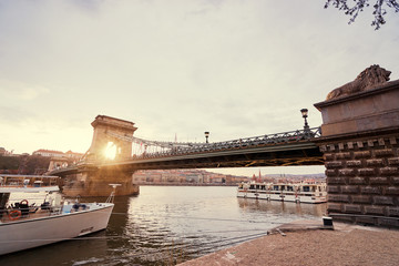 Chain bridge at sunset time on Danube river in Budapest city, Hungary.