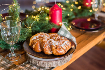 Sweet Christmas cake on table in room