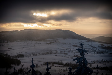 Panoramic view from Borowa Gora view point during winter time. Frosty structure, glazed, icy branches. Walbrzych in the background, Lower Silesia, Poland