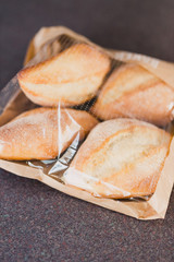 ciabatta panini bread in plastic bag shot at shallow depth of field, concept of packaged food 