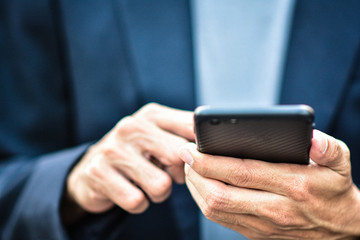 Close up man holding mobile smart phone