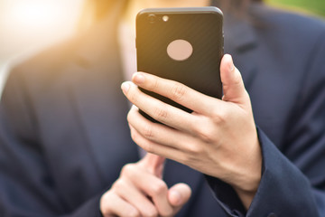 Business woman use smart phone at a car