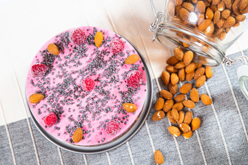 ice cream cake with raspberries, almonds and biscuits