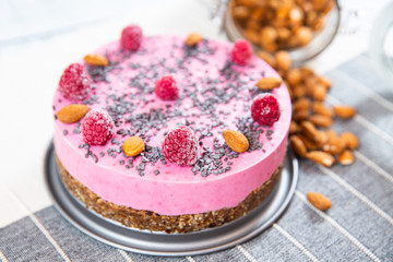 ice cream cake with raspberries, almonds and biscuits