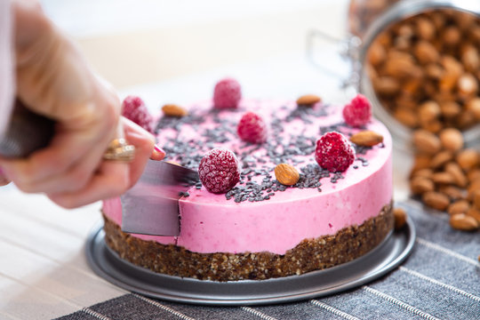 ice cream cake with raspberries, almonds and biscuits