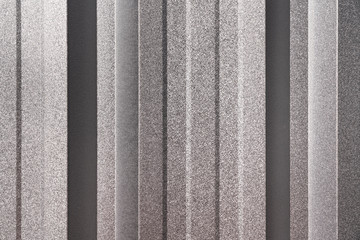 Metal, Aluminium or Zinc sheet wall background ans surface during it reflect with sun light. Close-up at the object.