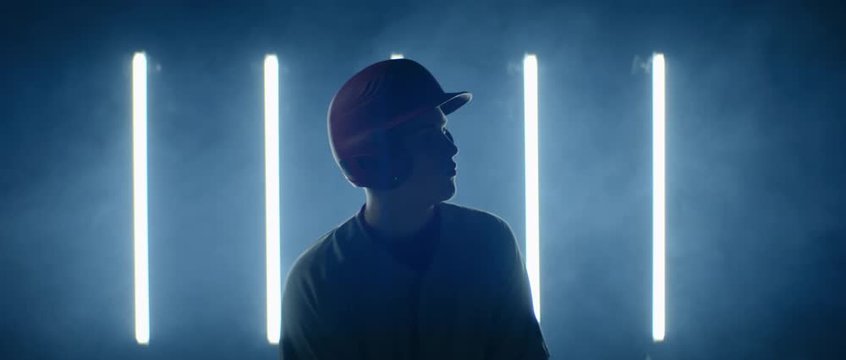 Caucasian professional baseball player batter posing against bright lights. 4K UHD 60 FPS SLOW MOTION shot on ARRI Alexa Mini with Atlas Orion 2x Anamorphic lens