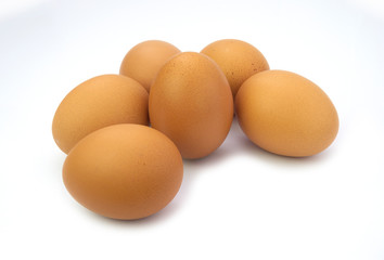 Six brown organic chicken eggs isolated on white background