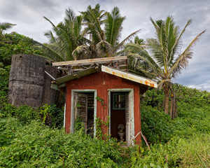 Fototapeta na wymiar A derelict toilet in the middle of nowhere on the tropical island of Niue.