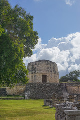 Fototapeta na wymiar Mayapan, Yucatan, Mexico: El Templo Redondo -- The Round Temple -- among the ancient Mayan ruins in Mayapan.