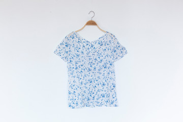 Woman blouse with blue blouse cotton on white background.