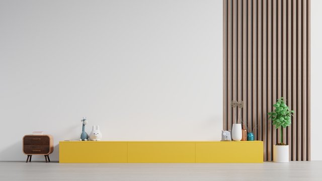 Yellow cabinet For TV or place object in modern living room with table,flower and plant on white wall background.