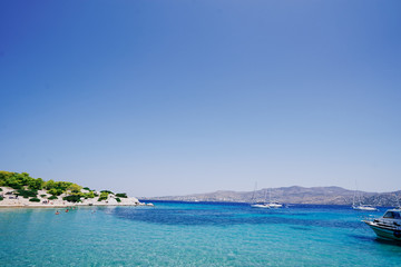Fototapeta premium Beautiful landscape with blue lagoon and beach. Moni Eginas Island, Saronic gulf, Greece . A famous tourist destination.