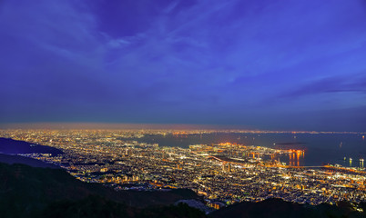 Kobe city panoramic view from Mt. Maya Kikusedai park observatory platform in sunny day sunset time with blue sky background, famous by the 10 ten million dollar night views. Hyogo Prefecture, Japan