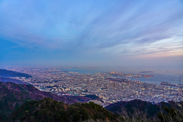 Kobe city panoramic view from Mt. Maya Kikusedai park observatory platform in sunny day sunset time with blue sky background, famous by the 10 ten million dollar night views. Hyogo Prefecture, Japan
