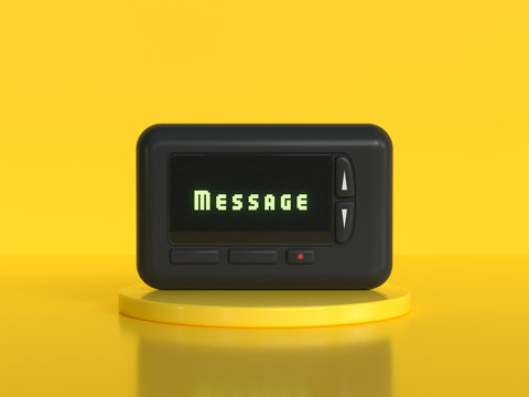 black mobile pager old technology yellow background