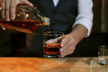 Bartender Serve Whiskey, on wood bar,