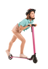 Teenage girl riding kick scooter on white background © Pixel-Shot