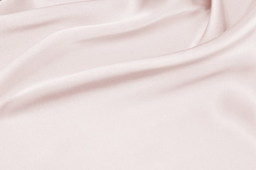 Delicate satin draped fabric pink texture for festive backgrounds