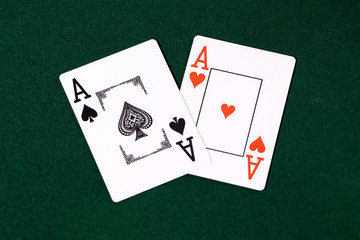 Playing cards for poker on a green table.  Gambling.