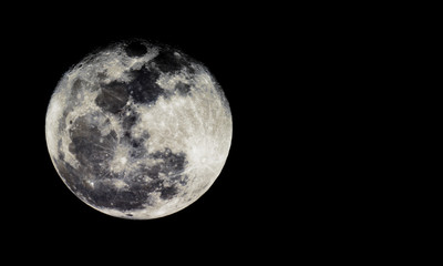 Full moon texture /  It is the fifth-largest satellite in the Solar System, and by far the largest among planetary satellites relative to the size of the planet that it orbits.